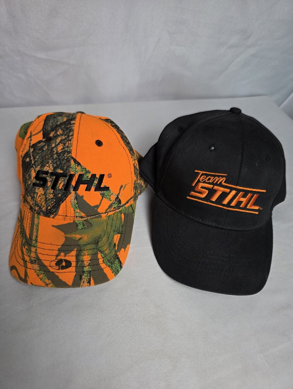 Stihl Outfitters Lot Of 2 Hats NWOT Orange Camo
